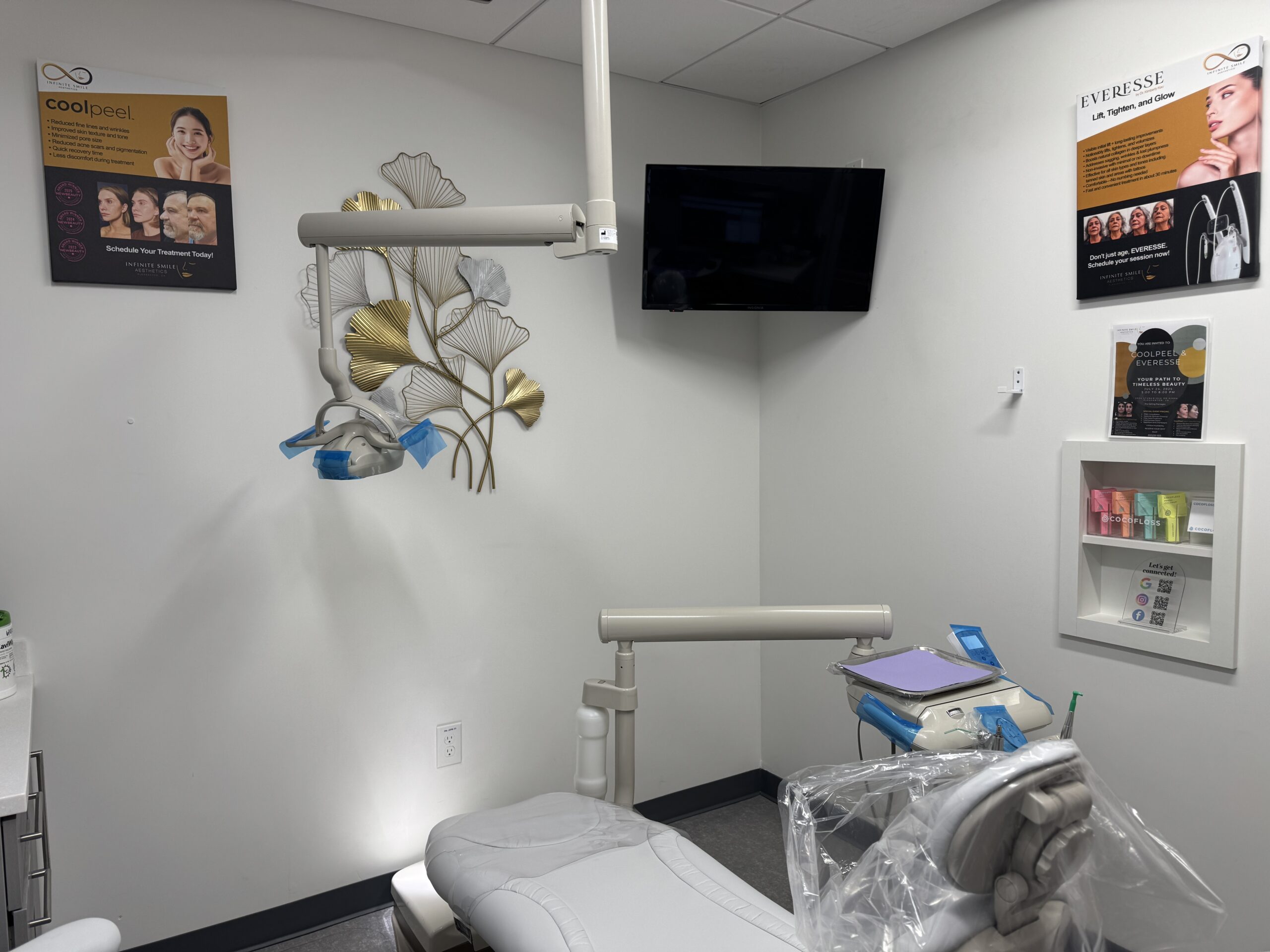 Modern facial spa treatment room featuring a comfortable patient chair and flat-screen TV