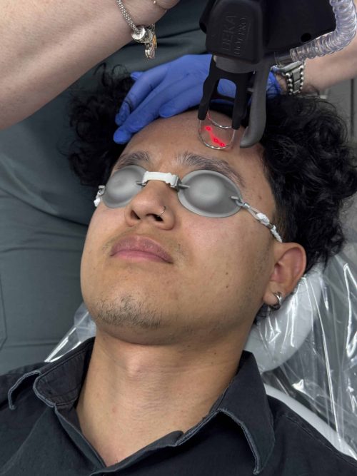 Man receiving professional facial spa treatment